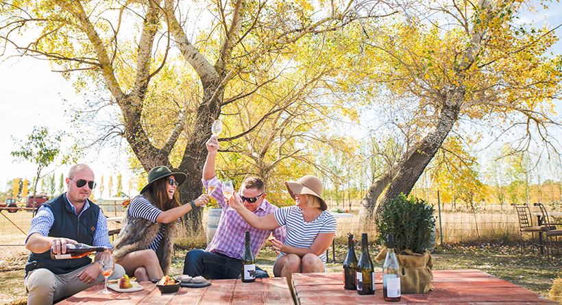 Four friends enjoying Heifer wines and a picnic